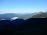 Jutro se prebuja in sonce kuka čez grebene vršacev. Levo je Matajur, skrajno desno Krasji vrh, greben iz sredine slike pa sega do Kobariškega Stola.